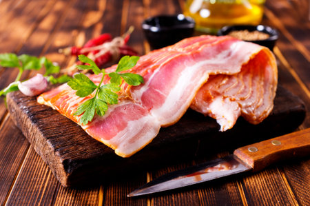 smoked bacon slices for hot pot on a tableの写真素材