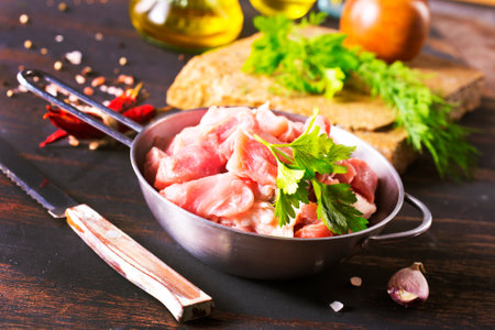 raw meat in metal bowl, meat and herb and spices for cookingの写真素材