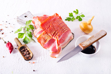 smoked bacon slices for hot pot on a tableの写真素材