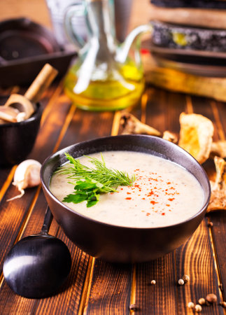 Musroom soup served with parsley leaf in bowlの写真素材
