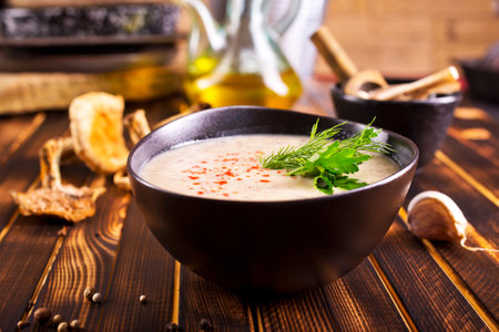 Musroom soup served with parsley leaf in bowlの写真素材