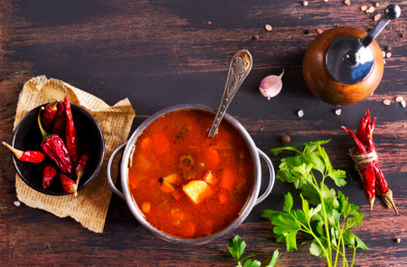 Meat Solyanka soup with sausages, olives and vegetablesの写真素材
