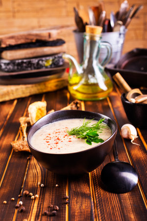 Musroom soup served with parsley leaf in bowlの写真素材