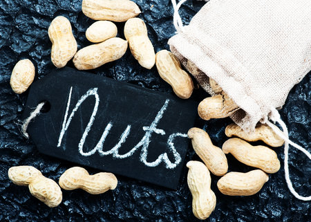 peanuts on the black background,k dry peanutsの写真素材