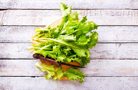 ripe organic green salad on board