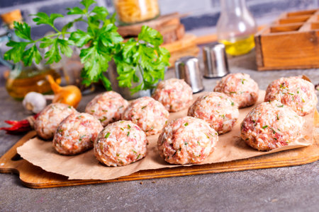 Raw meatballs made from ground beef.の写真素材