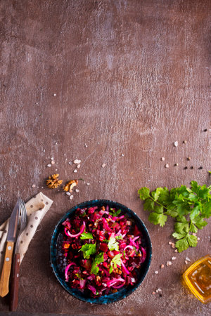 Traditional Russian vegan salad with potato and beetroot in bowlの写真素材
