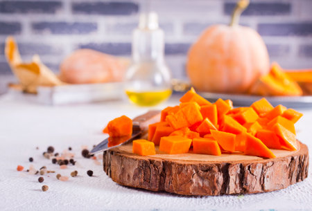 raw pumpkin on light tableの写真素材