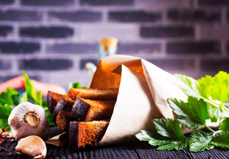 Pieces of dry bread. rye bread croutons beer appetizer, garlic rye croutonsの写真素材