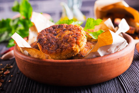 fried cutlets on brown bowl on a tableの写真素材