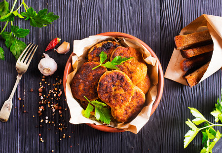 fried cutlets on brown bowl on a tableの写真素材
