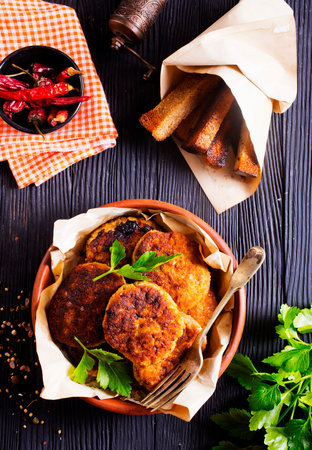fried cutlets on brown bowl on a tableの写真素材