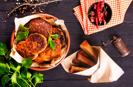 fried cutlets on brown bowl on a tableの写真素材