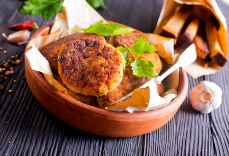 fried cutlets on brown bowl on a tableの写真素材