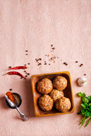 Beef meatballs. Cooking raw beef meatballs in bowlの写真素材