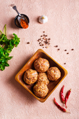 Beef meatballs. Cooking raw beef meatballs in bowlの写真素材
