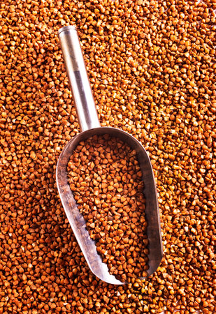 Close up raw buckwheat background. gluten free ancient grain for healthy diet, selective focusの写真素材