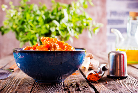 Chicken curry served in bowl on a tableの写真素材