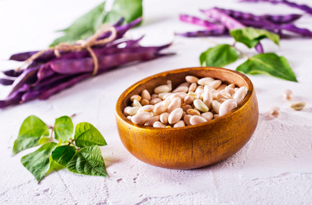 Organic White Beans with green leaves in a Bowl,