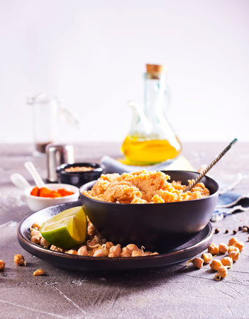 Delicious and homemade hummus with lime and spiceの写真素材