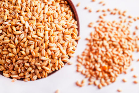 Pearl barley groats in bowl, top view