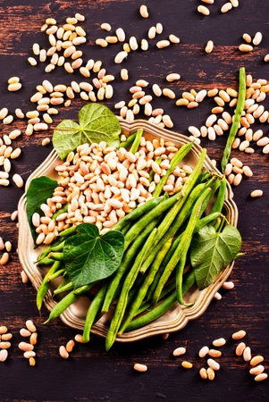 Common bean on darkj table with leaf