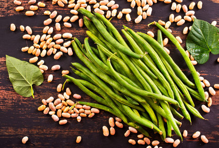 Common bean on darkj table with leaf