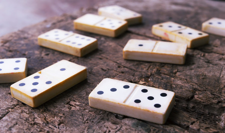 Old domino game on wood backgroundの写真素材