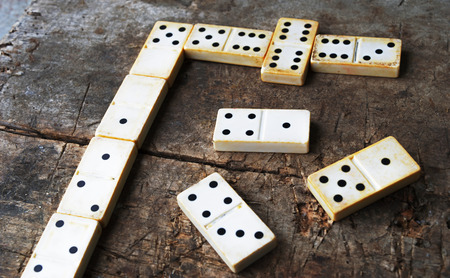 Old domino game on wood backgroundの写真素材