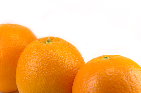Fresh orange fruits isolated on white backgroundの写真素材