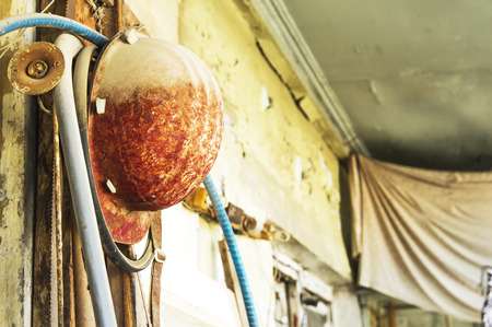 Old construction helmet on the abandoned workplaceの写真素材