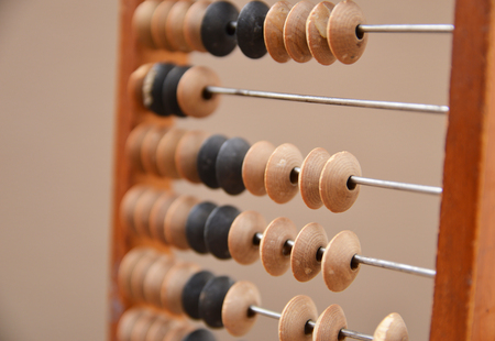 Old wooden abacus on gray backgroundの写真素材
