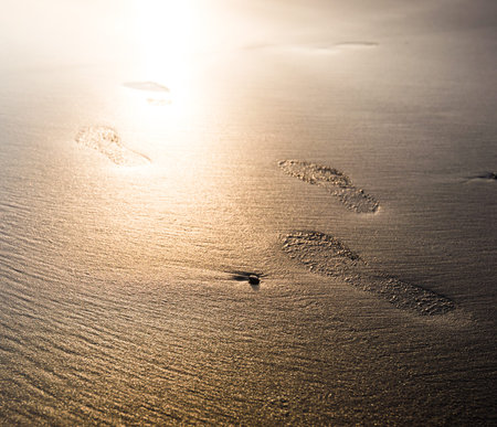 Traces of the person on the beach sand
