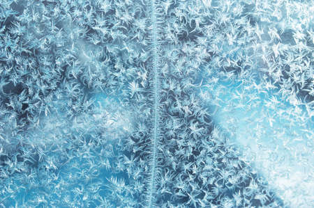 Frost pattern on a window. Background photoの写真素材