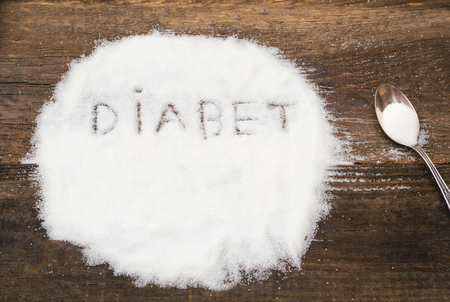 Diabet sign made of granular sugar. The picture illustrates the harm of eating sugar and salt, as well as the incidence of diabetes.の写真素材