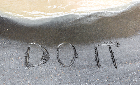 Words do it written on the river sand, conceptual textの写真素材