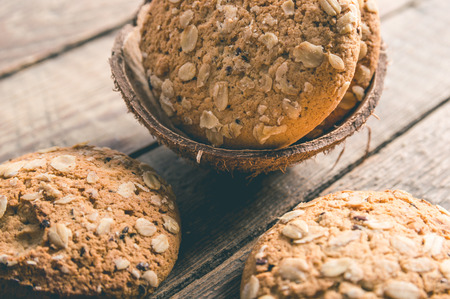 Dietary oatmeal cookies in a coconut peelの写真素材