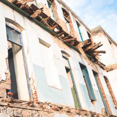 Walls and facade of an old ruined abandoned buildingの写真素材