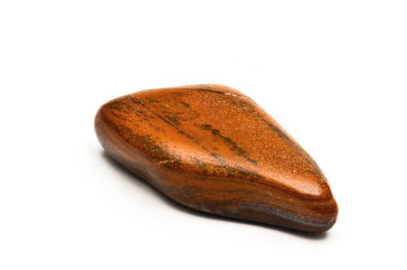 Tiger eye chatoyant gemstone isolated on white backgroundの写真素材