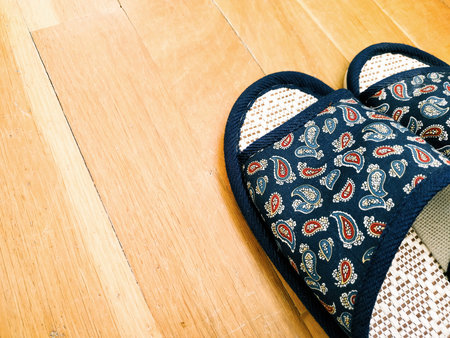 Home slippers on the parquet backgroundの写真素材