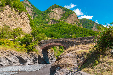 Old stone bridge named Ulu Korpu was built in the 18th century near Ilisu village, northwest Azerbaijanの写真素材