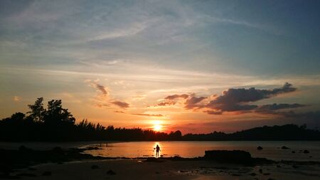 Sunset by the beachの写真素材