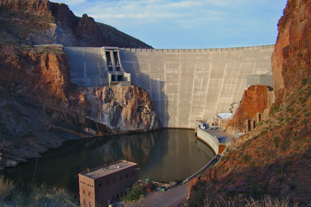 The down-river side of Roosevelt Dam on the Salt River creating Roosevelt Lake, taken from the Apache Trail Highway. Part of the Salt River Project, which provides water and electricity for all of Metro Phoenix in Arizona.の写真素材
