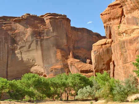 Towering red rock walls in Canyon de Chelly on the Navajo Nation in northeast Arizona.の写真素材