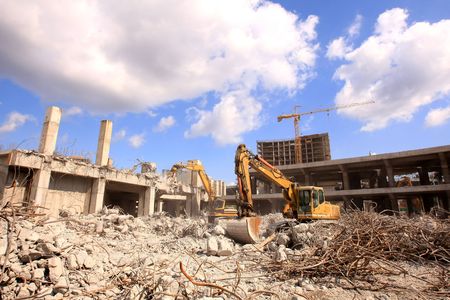 Urban renewal in the city centre. Digger working during dismanlingの写真素材