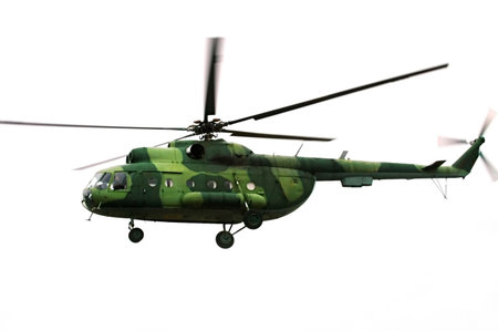   Flying military  helicopter isolated on white                             