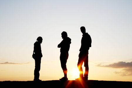 Silhouette of a Group of People on sunsetの写真素材