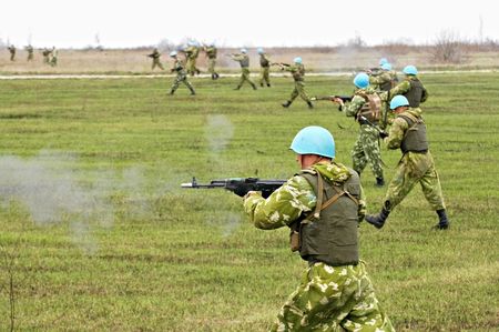 soldier in a combat uniform attackの写真素材
