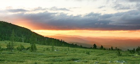 dramatic clouds under the Altai mountains in the sunset