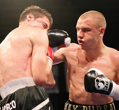 KYIV, UKRAINE - JUNE 14: Ukrainian Maxim Bursak (R) fights with his Italian opponent Giovanni de Carolisa during the boxing tournament on June 14, 2008 in Kyiv, Ukraineのeditorial素材
